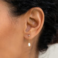 Pearl drop earrings in 14k gold with white sapphire
