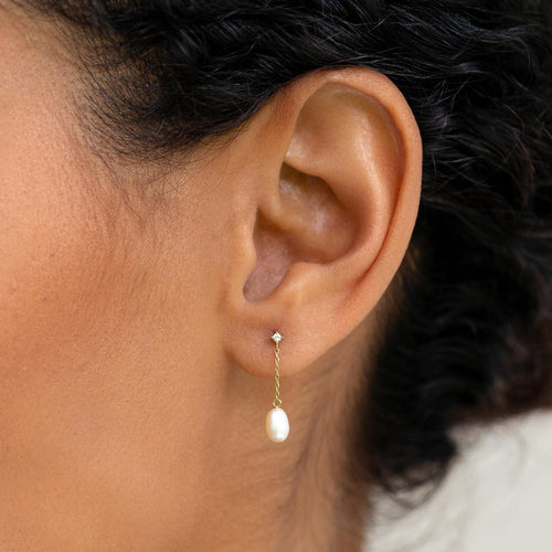 Pearl drop earrings in 14k gold with white sapphire