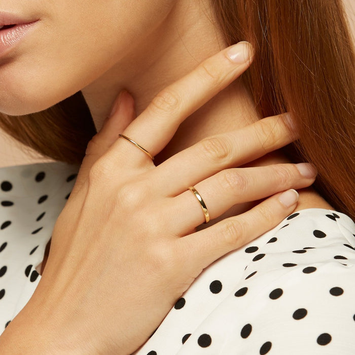 Solid gold stacking ring on model