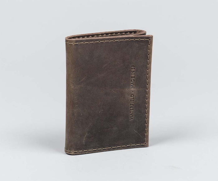 Compact, tri-fold design made from full-grain leather