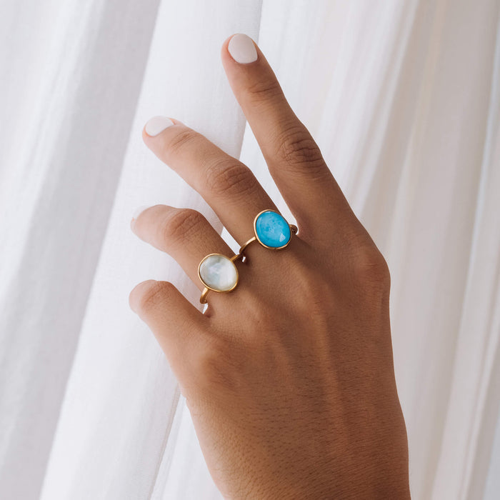 Bezel-set gold gemstone rings in amalfi blue and green amethyst