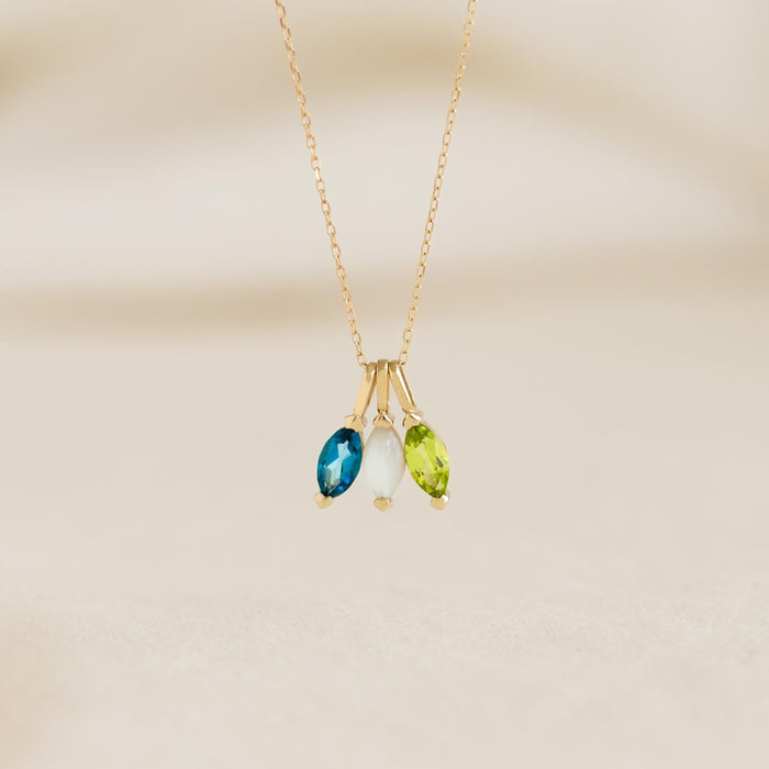 August Birthstone Pendant 14k Gold - Olivine with marquise-cut gemstones hanging on a delicate gold chain