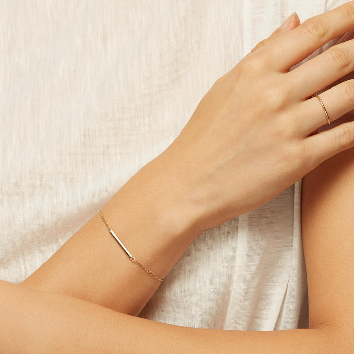 Thin bar on gold chain bracelet