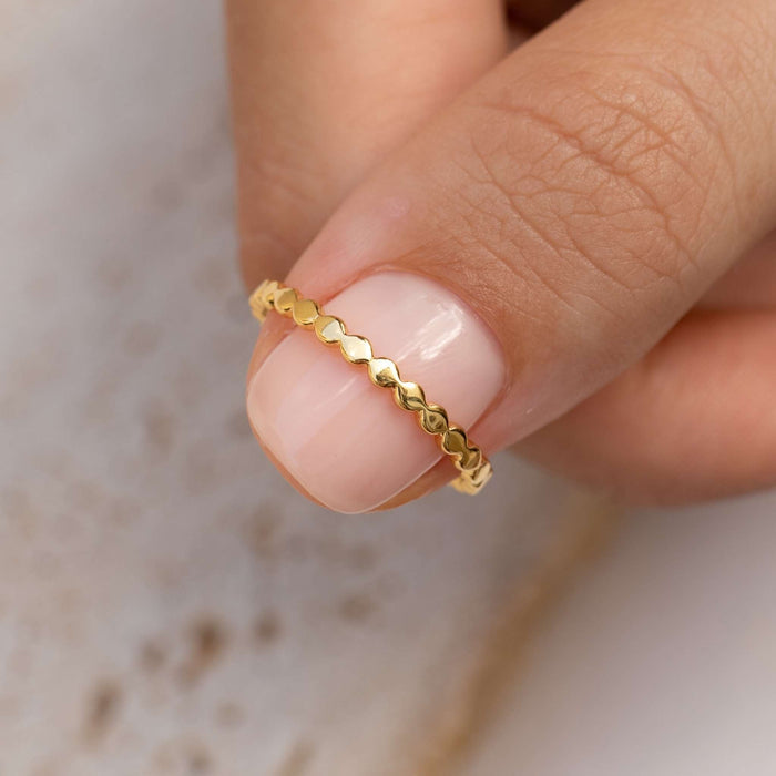 Gold vermeil beaded ring on hand