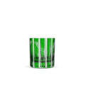 A green crystal tumbler with a detailed banana leaf design.