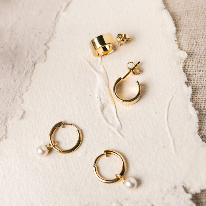 Gold vermeil hoop earrings with a butterfly backing and hinged backing
