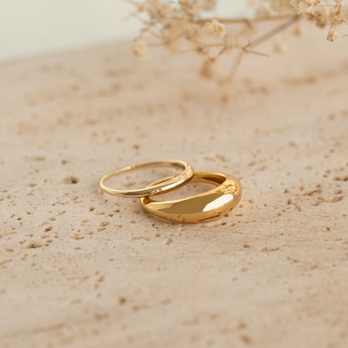 Dome Ring - Arielle gold vermeil statement ring with a puffy tapered design displayed on a textured surface
