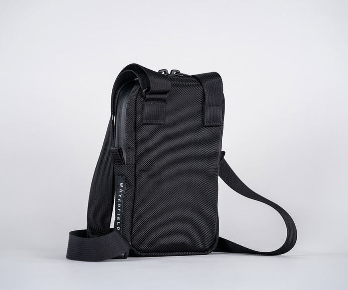 Back. Includes adjustable cam-lock strap