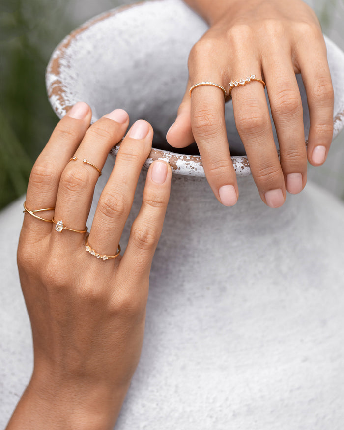 Gold vermeil rings with white topaz gemstones on hands