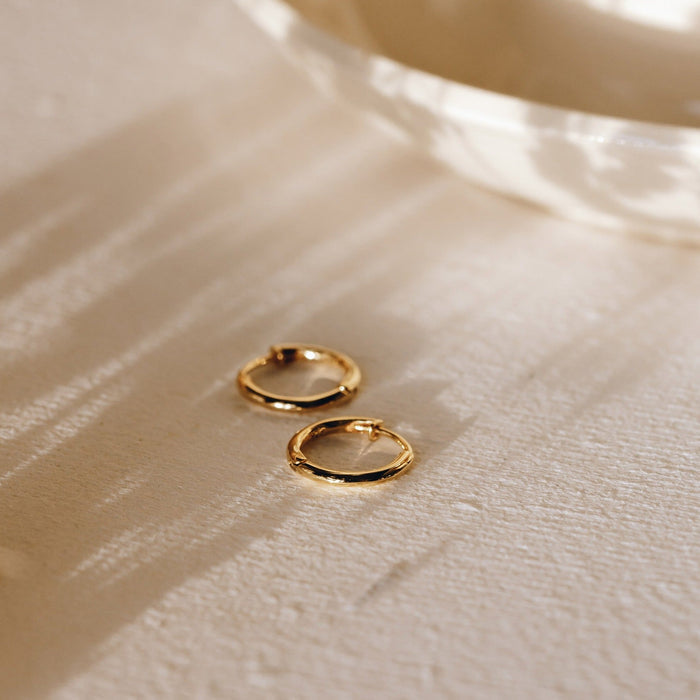 Huggie hoop earrings in gold vermeil