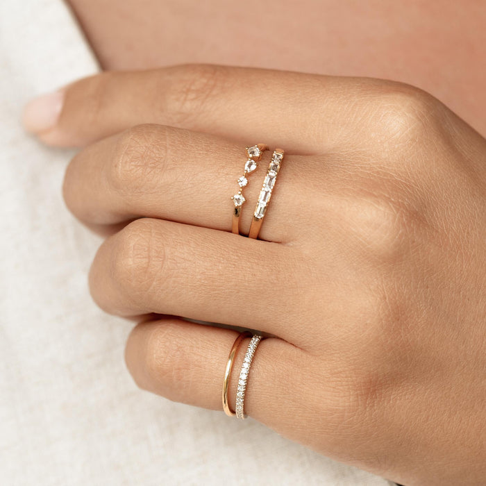 Gold vermeil stacking rings on model with diamonds and gemstones