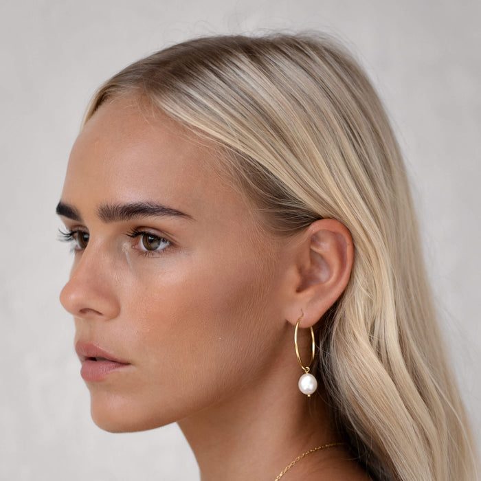 Gold vermeil baroque pearl charm hoops on model
