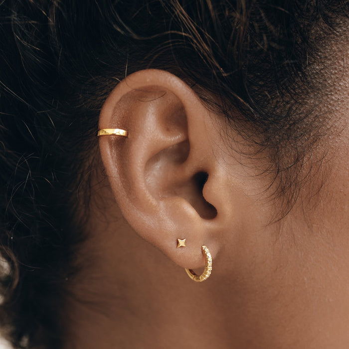 Gold vermeil huggie earrings with white topaz gemstones