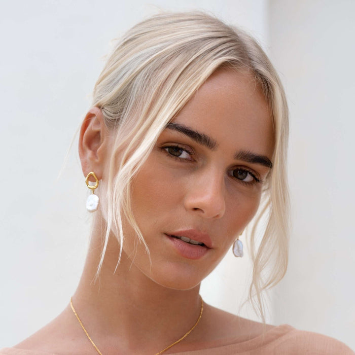 Hammered sterling silver setting with pearl drop earrings