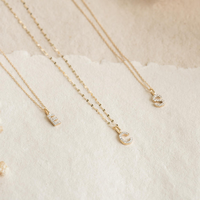 Diamond Initial Pendant 14k Gold - S with brilliant diamonds on delicate gold chain displayed on neutral background