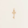 Yellow Gold key-shaped pendant design and polished finish, shown against a light neutral background.