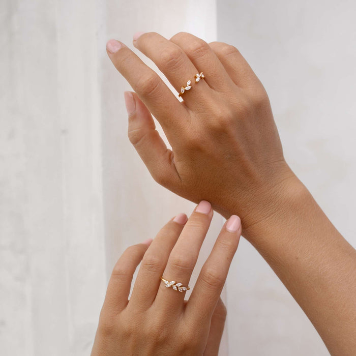 Two gold vermeil rings with cubic zirconia leaf designs