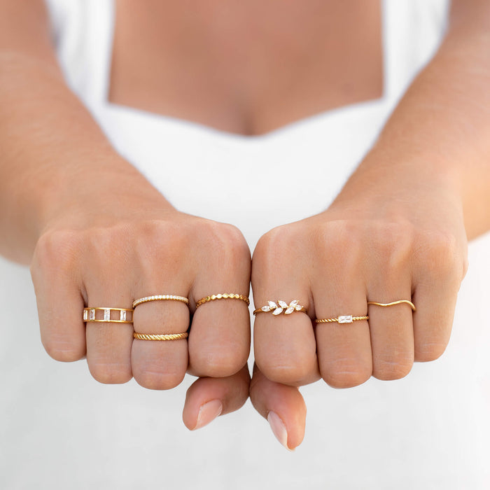 Cubic zirconia stacking rings in gold vermeil on model