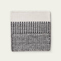 Linear Wool Rug with black and white pattern on a light gray background, #ashblack