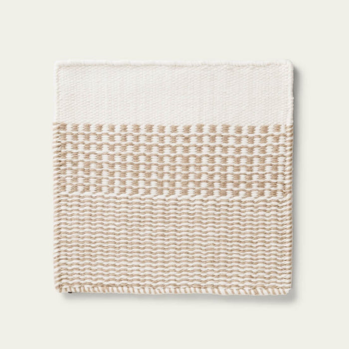 Linear Wool Rug with beige and white pattern on a light gray background, #coastalcream