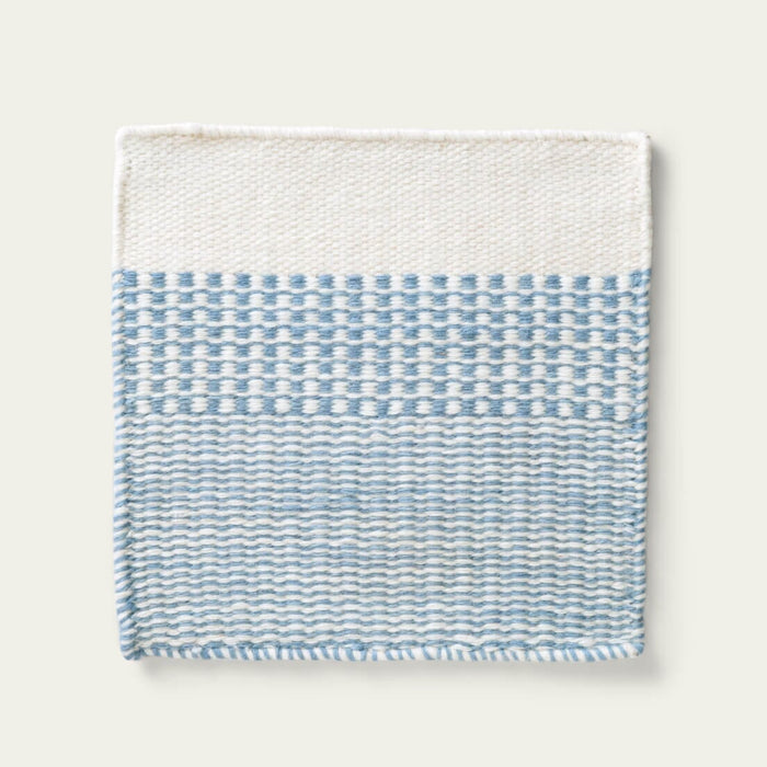 Linear Wool Rug with blue and white pattern on a light gray background, #duskblue
