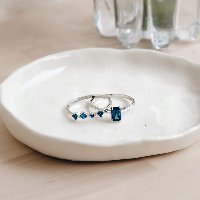 London blue topaz rings in sterling silver with irregular stones and baguette stone