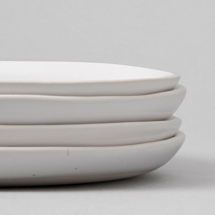 Lunch plates dinnerware by Fable Home, shown in a speckledwhite finish, side view. – #speckledwhite