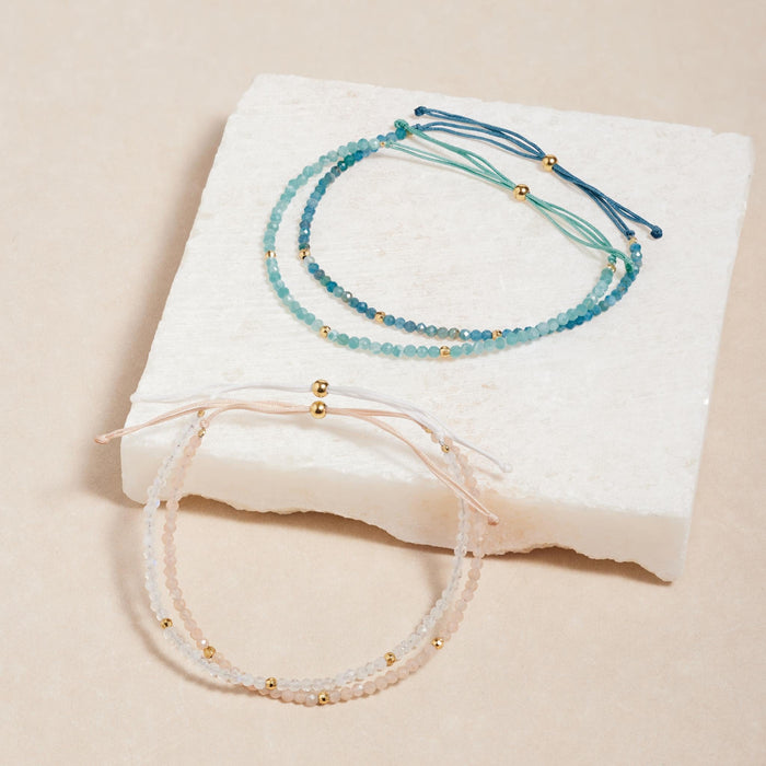 4 adjustable beaded bracelets with gemstones and gold accents