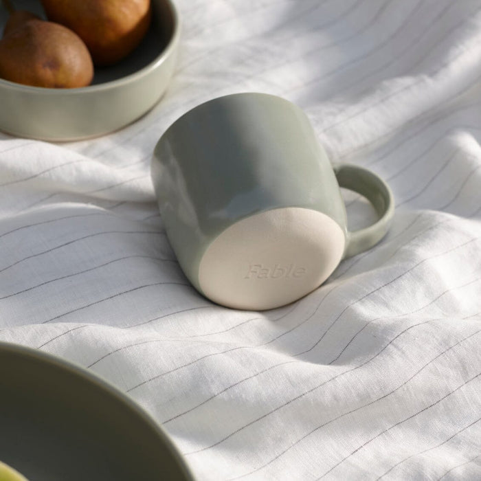 Mugs dinnerware by Fable Home, shown in a beachgrassgreen finish. – #beachgrassgreen