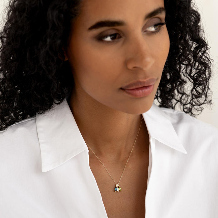 Close-up of woman wearing November Birthstone Pendant 14k Gold - Citrine styled with a white collared shirt