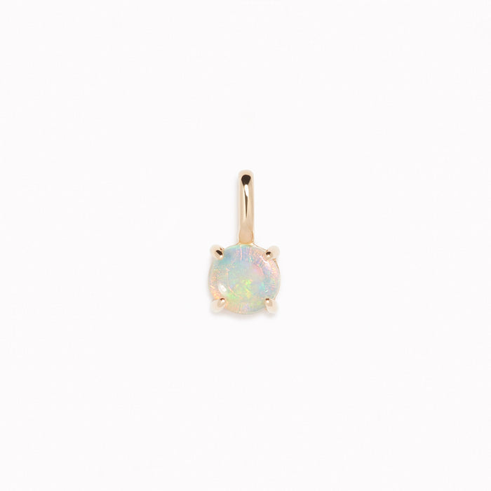 Opal Charm 14k Gold with iridescent opal gemstone set in 14k yellow gold on a white background