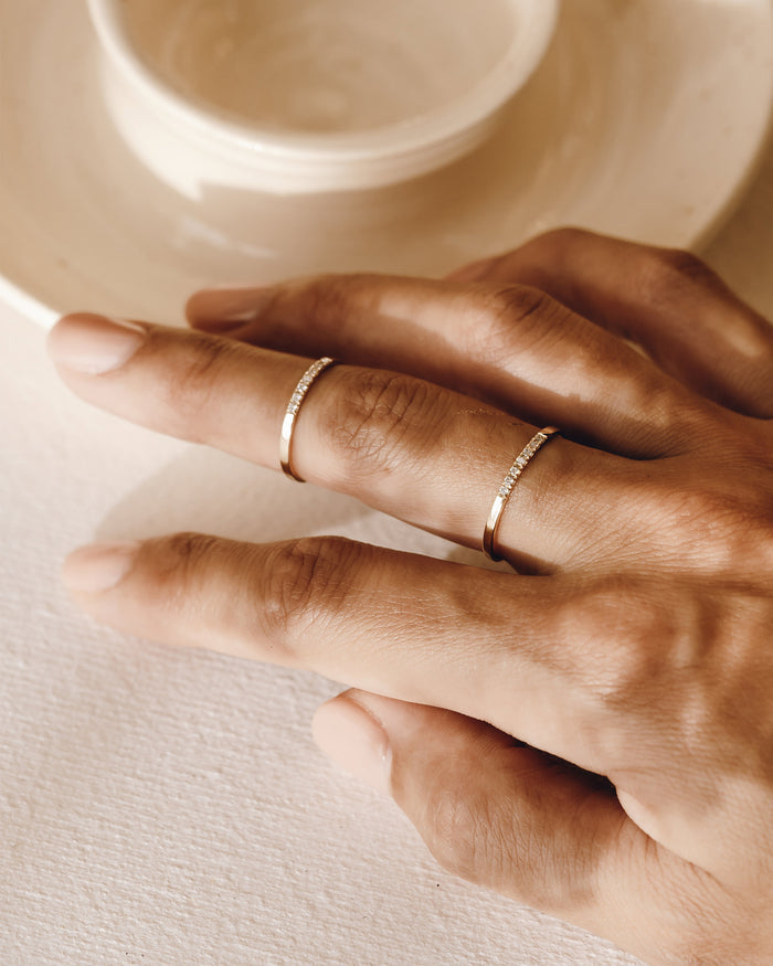 Pave rings with white topaz set on gold vermeil band on model