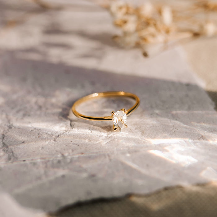 Single white topaz gemstone with gold vermeil band