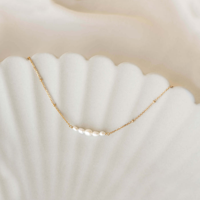 Close-up of Pearl Boat Necklace - Zanna featuring five graduated freshwater pearls on a gold vermeil beaded chain