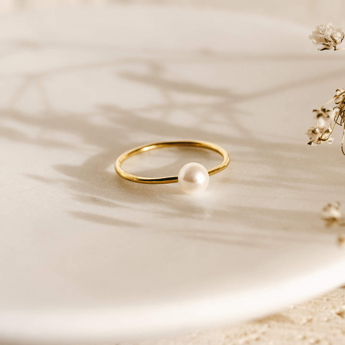 Pearl ring with a pearl on a gold band