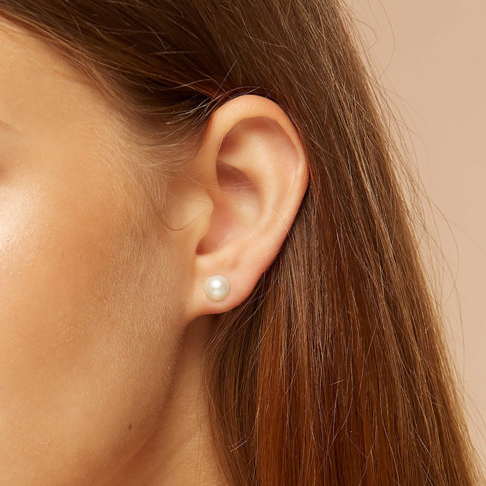 Pearl ear studs in silver