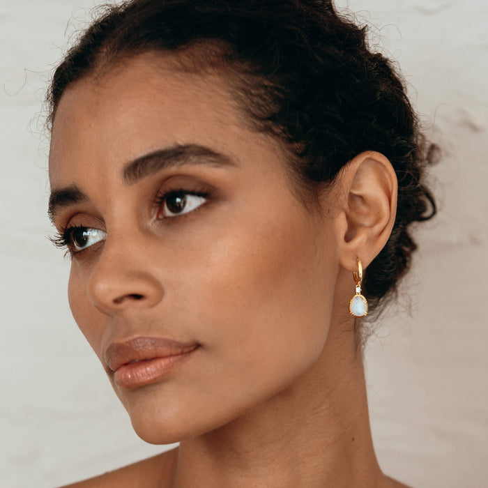 Organically shaped moonstones on drop earring with gemstone
