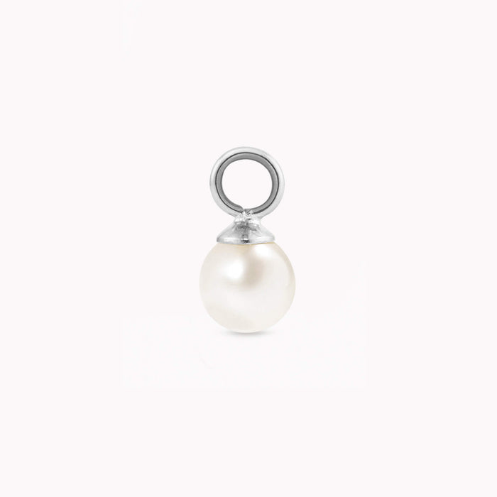A single, luminous pearl charm with a smooth, white surface and a silver loop for attaching. The pearl exudes elegance against a plain white background.