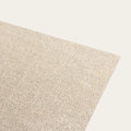 A beige, low profile rug pad made from natural rubber and handwoven jute fibers, designed to fit beneath a rug. #natural