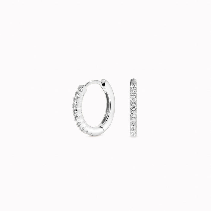 1.5mm thick silver huggie earrings with white gemstones