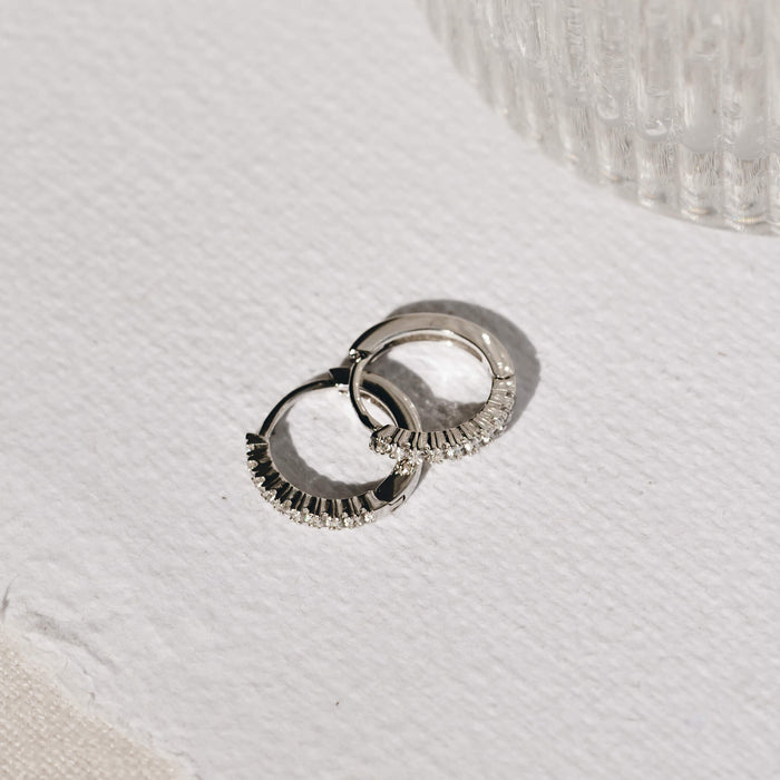 Recycled silver huggie earrings with 9 white topaz stone