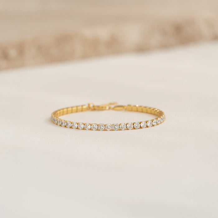 Close-up of Tennis Bracelet - Zilla featuring round cubic zirconia stones set in gold vermeil on a neutral background