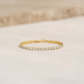 Close-up of Tennis Bracelet - Zilla featuring round cubic zirconia stones set in gold vermeil on a neutral background