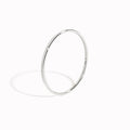 Thin White Gold Ring - Elin photographed on white background with soft shadow highlighting its minimal design