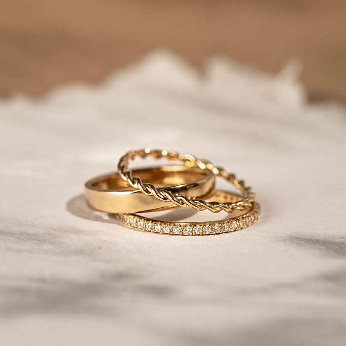 Three gold vermeil stacking rings with twist ring and diamond band
