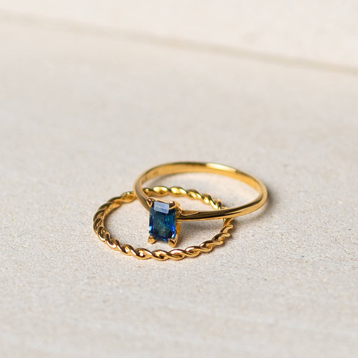 Gold vermeil twist ring and blue topaz baguette cut gemstone ring