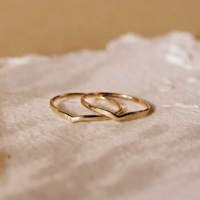 Two gold stacking rings with V-shape