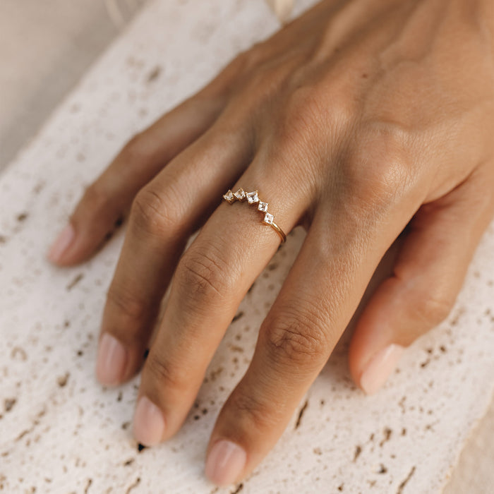 5 white topaz stones on gold ring