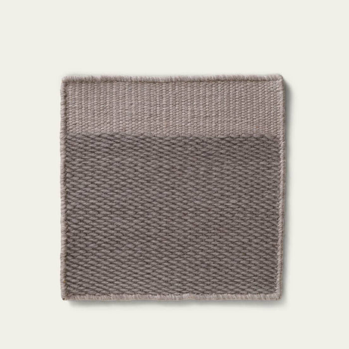 Broun textured rug on a light gray background, #slategray
